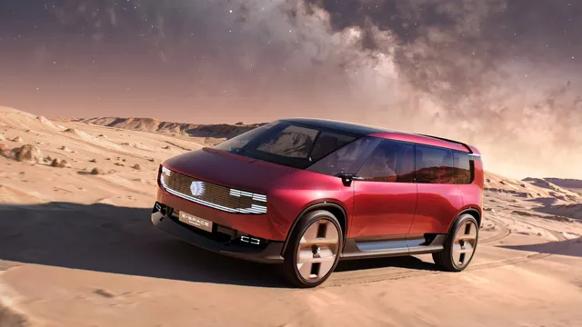 Monovolume Renault E-Space Concept vermelho, de linhas retas e grandes vidros, numa paisagem de deserto ao anoitecer